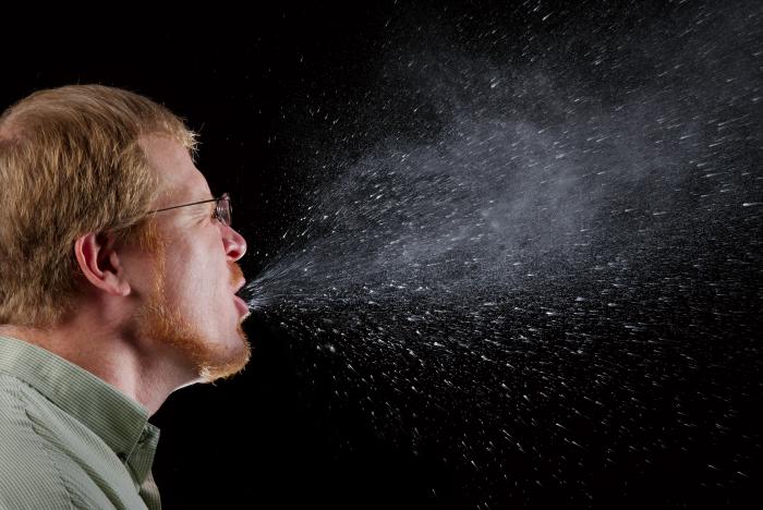 Man coughing droplets