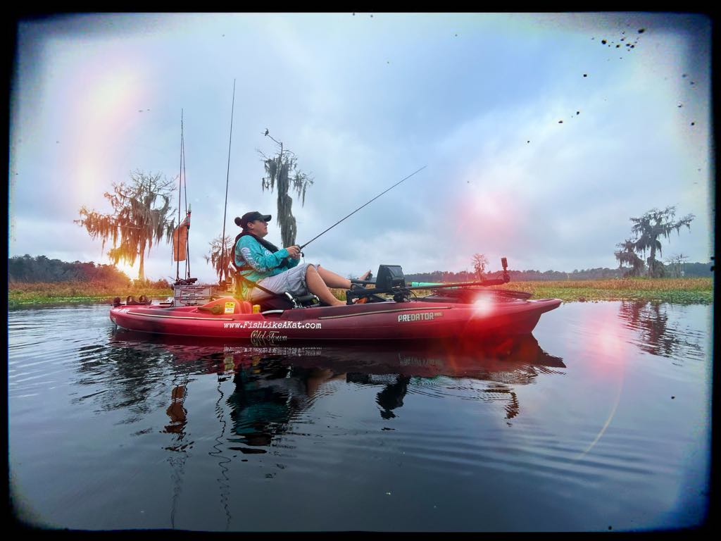 Text: Photo of Katie Backa fishing from a kayak taken by Blake Abbey