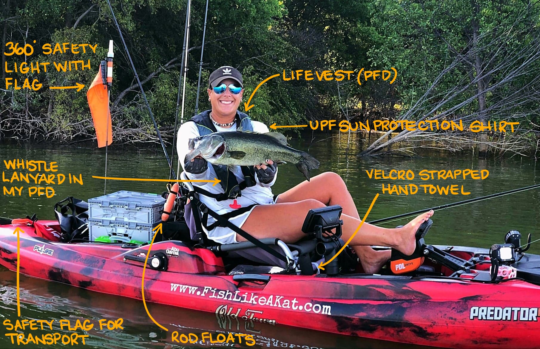 Kat in her kayak full of safety and fishing gear with a 5 pound fish