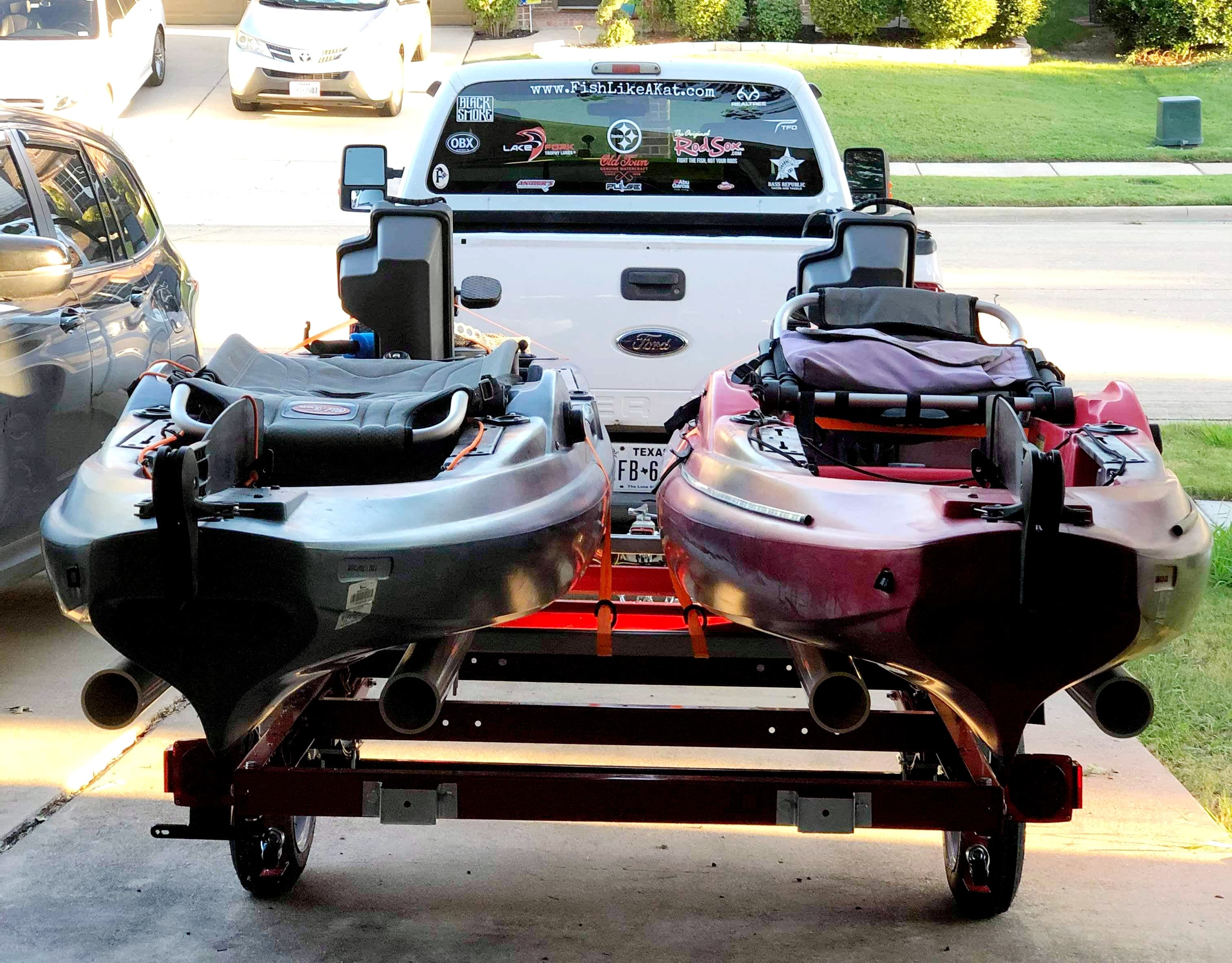 Rear view of an Old Town Predator PDL and Bigwater PDL on a trailer