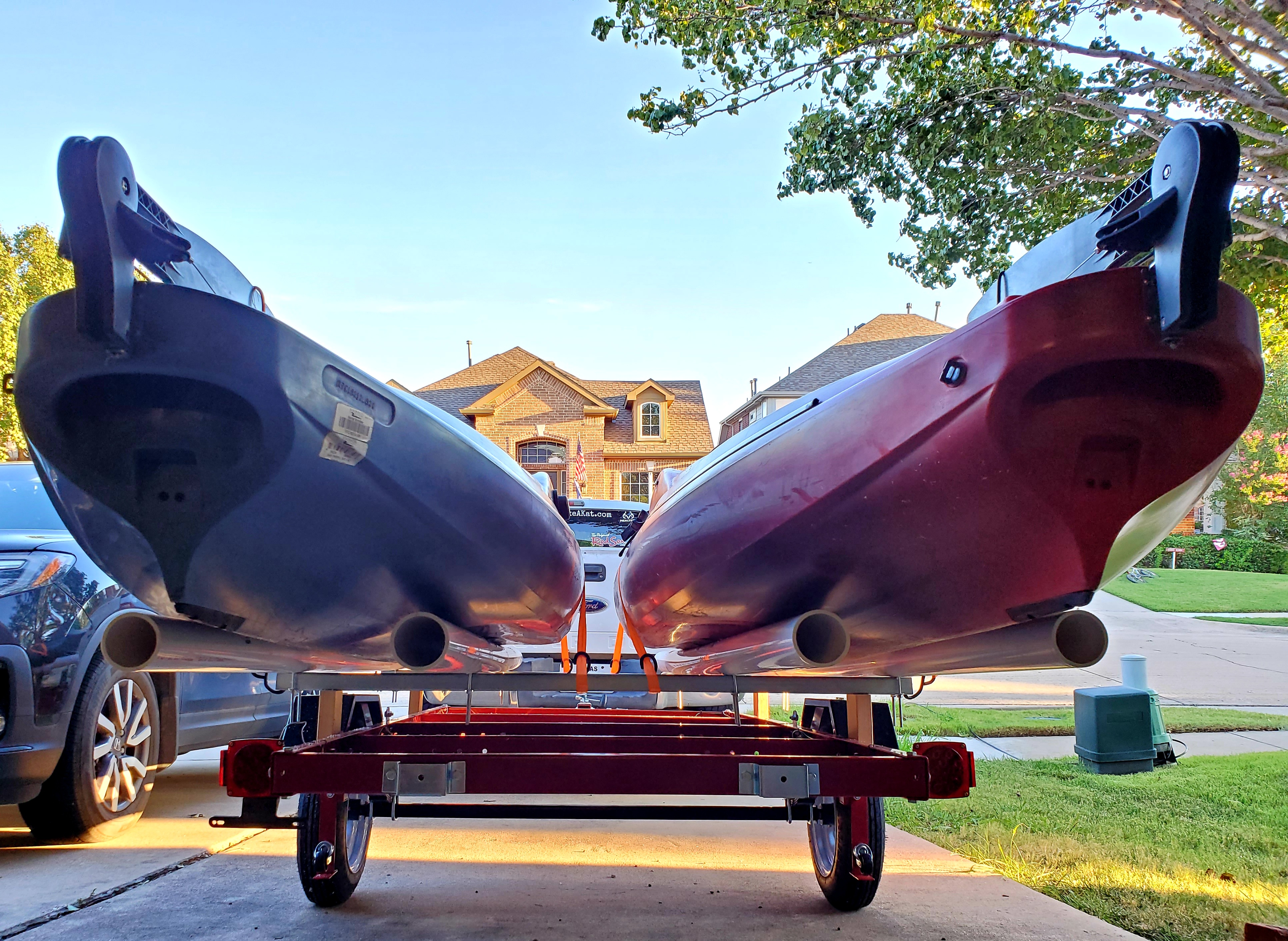 View of the undersides of the Old Town Bigwater PDLs on a kayak trailer